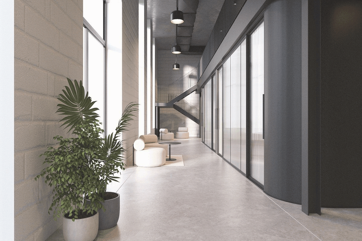 A bright interior hallway with a plant, Madeira location
